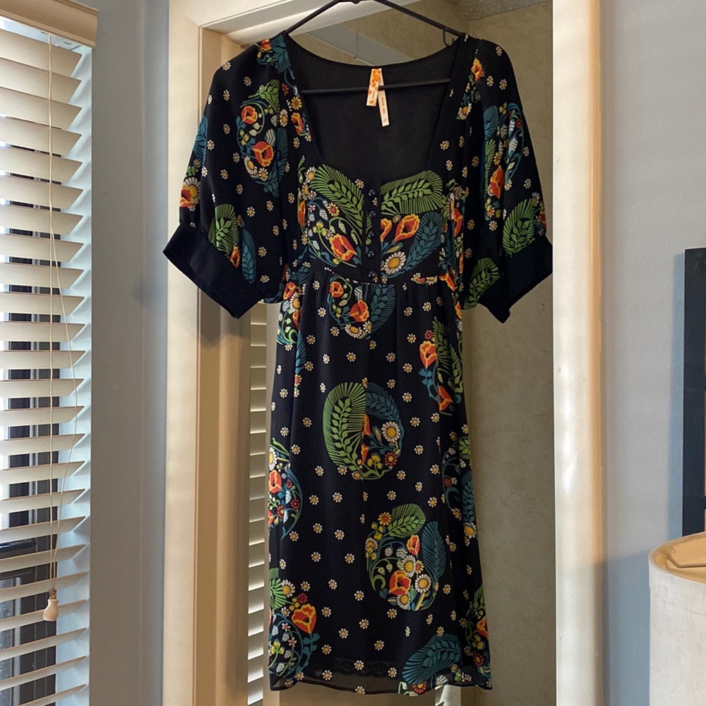 Excellent condition. Dry clean only. 100% silk shell; lining is taffeta.